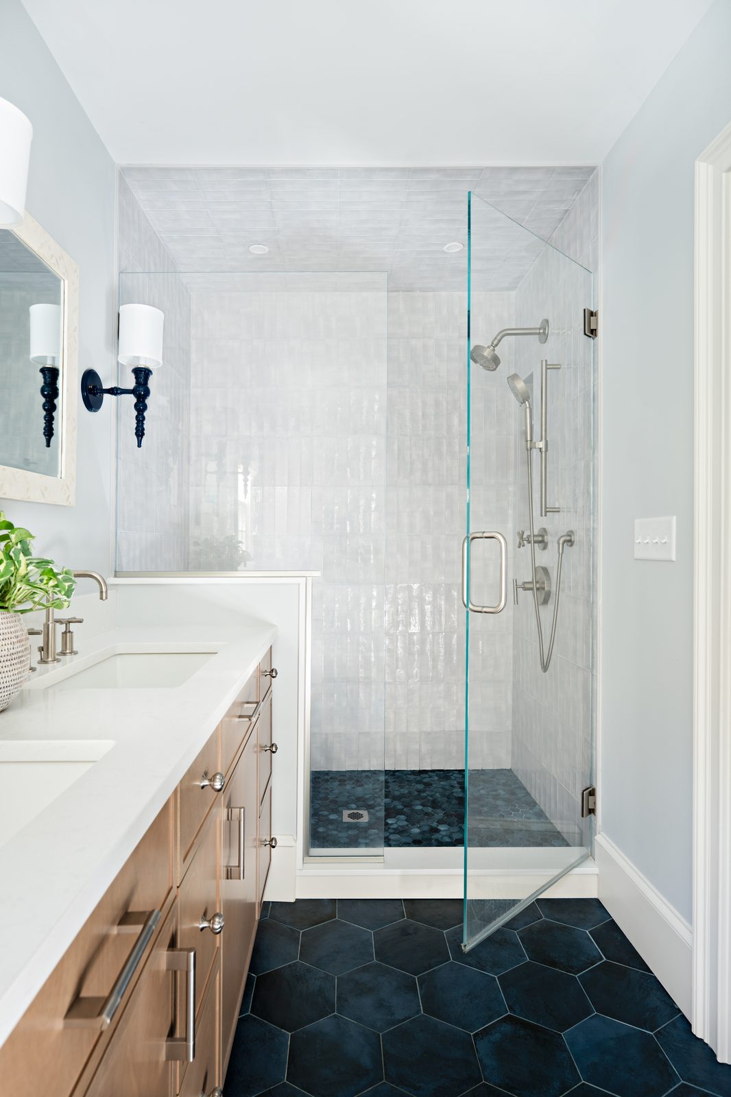 Jerusalem Road bathroom with dark hexagon floor tile, glass shower enclosure, and white oak vanity